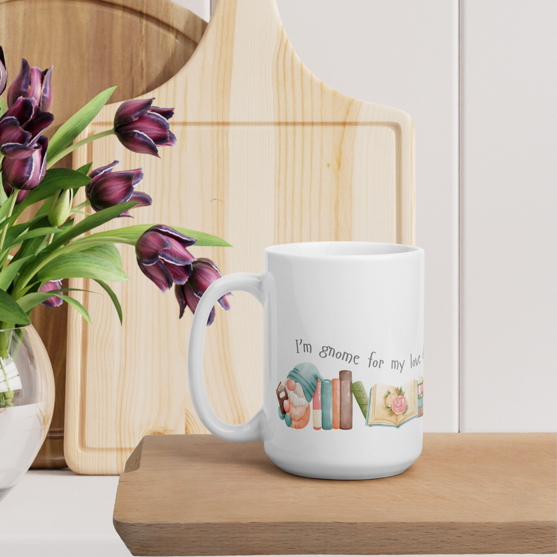 A ceramic mug in 11 and 15 oz sizes with cute little gnomes reading books and a caption that reads I'm gnome for my love of books. A great gift mug for those who love reading and gnomes. 
