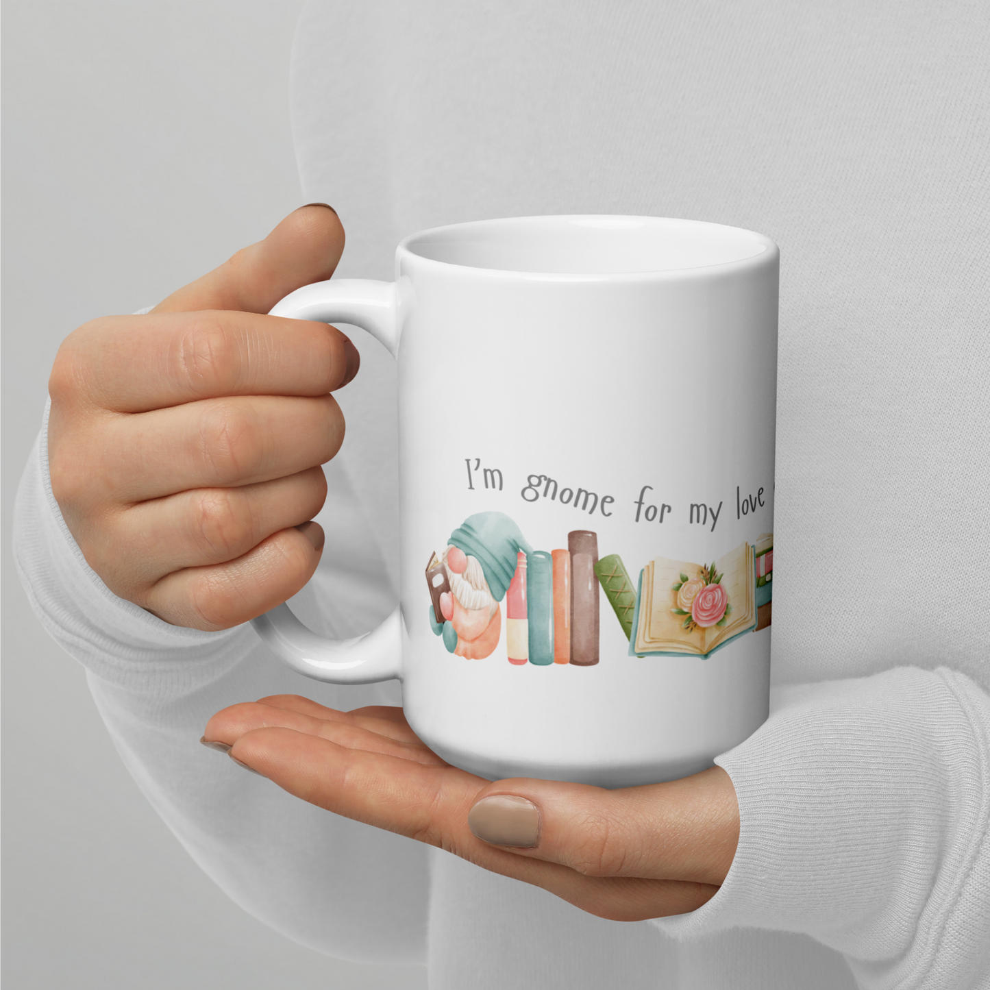A ceramic mug in 11 and 15 oz sizes with cute little gnomes reading books and a caption that reads I'm gnome for my love of books. A great gift mug for those who love reading and gnomes. 