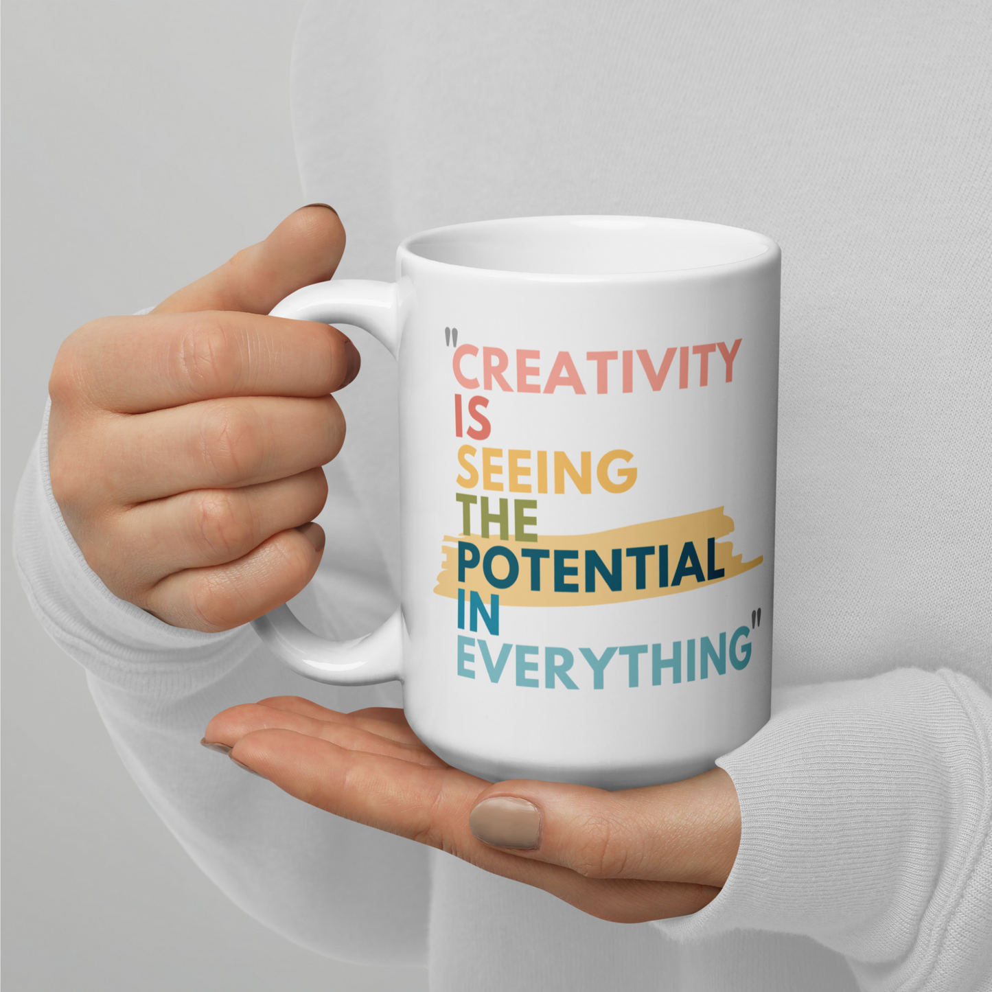 15 oz white glossy mug with the caption Creativity is Seeing the Potential in Everything. A Great gift for creative minds, a mug for artists, even makes a fun inspiring pencil holder for the office or craft room. The Bold colorful text makes the design stand out. 