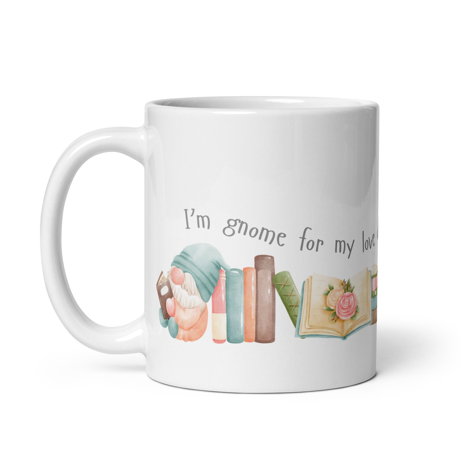 A ceramic mug in 11 and 15 oz sizes with cute little gnomes reading books and a caption that reads I'm gnome for my love of books. A great gift mug for those who love reading and gnomes. 